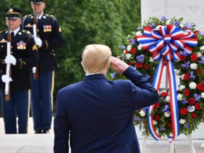 US President Donald Trump salutes as he participates in a Wreath Laying Ceremony at the Tomb of the Unknown Soldier at Arlington National Cemetery to commemorate Memorial Day, and honor those who have died while serving in the US Armed Forces on May 25, 2020 in Arlington, Virginia. (Photo by …