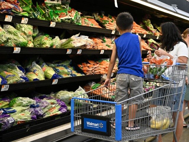 Consumers shop in the produce section of a Walmart store in Burbank, California on August