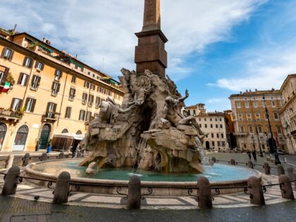 ROME, ITALY - 2020/04/30: A view of the Fountain of the Four Rivers of Gian Lorenzo Bernini in an almost desert Navona square during Italy's lockdown due to Covid-19 pandemic. On May 4th will start the phase 2 of the measures against pandemic, adopted by Italian government, that will allow …