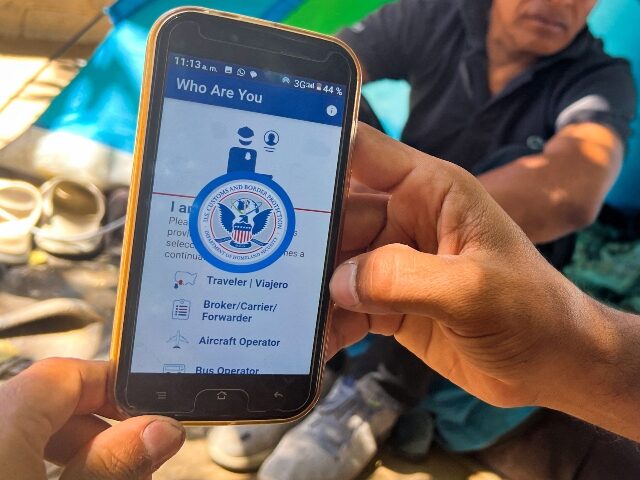 A migrant shows the CBP One App from the US Customs and Border Protection agency, to use to apply for an appointment to claim asylum, on a phone in Ciudad Juarez, Chihuahua state, Mexico, on May 10, 2023. The US on May 11, 2023, will officially end its 40-month Covid-19 …