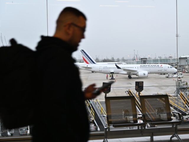 PARIS, FRANCE - JANUARY 25: A Passenger walks at the Charles de Gaulle Airport near Paris,