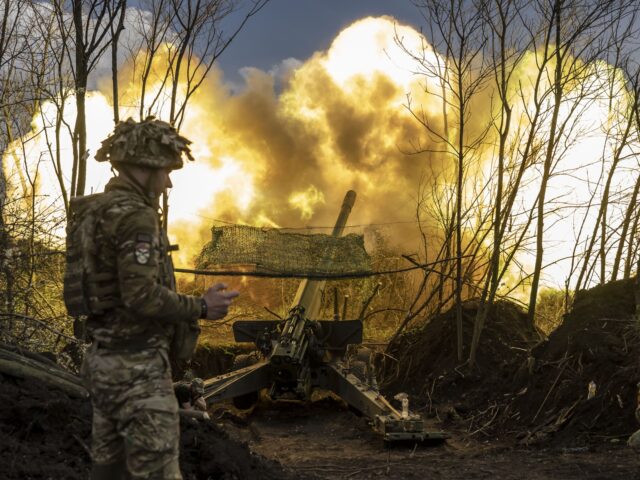 DONETSK OBLAST, UKRAINE - APRIL 24: Ukrainian soldiers fire artillery on Donetsk frontline