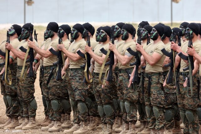 Fighters from Lebanon's Hezbollah Iran-backed militant group hold military drills in south