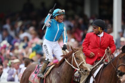 Jockey Javier Castellano celebrates atop of Mage after winning the 149th running of the Ke