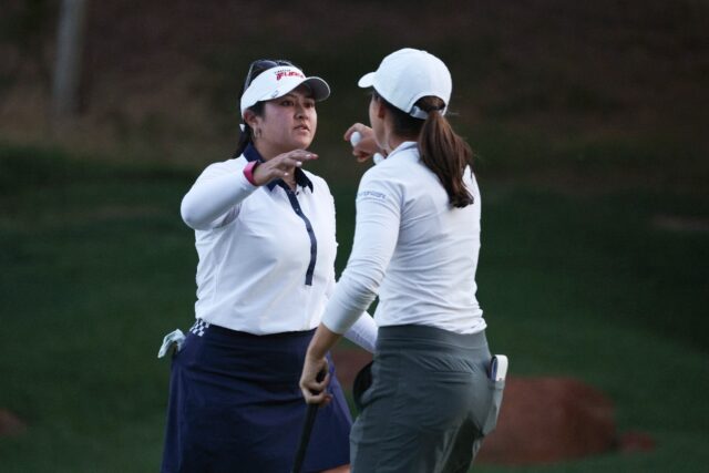 Lilia Vu of the United States hugs Albane Valenzuela of Switzerland after their match at t