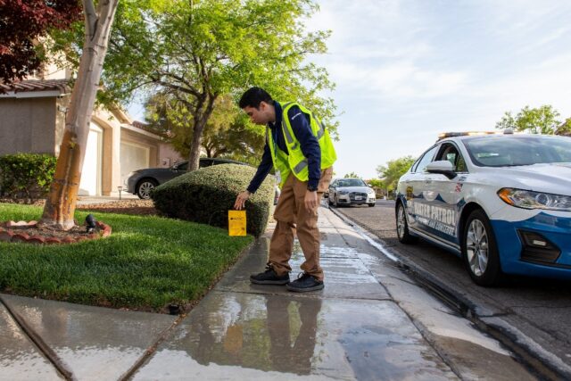 Waste water investigators film any violation, before planting a warning flag on the lawn f