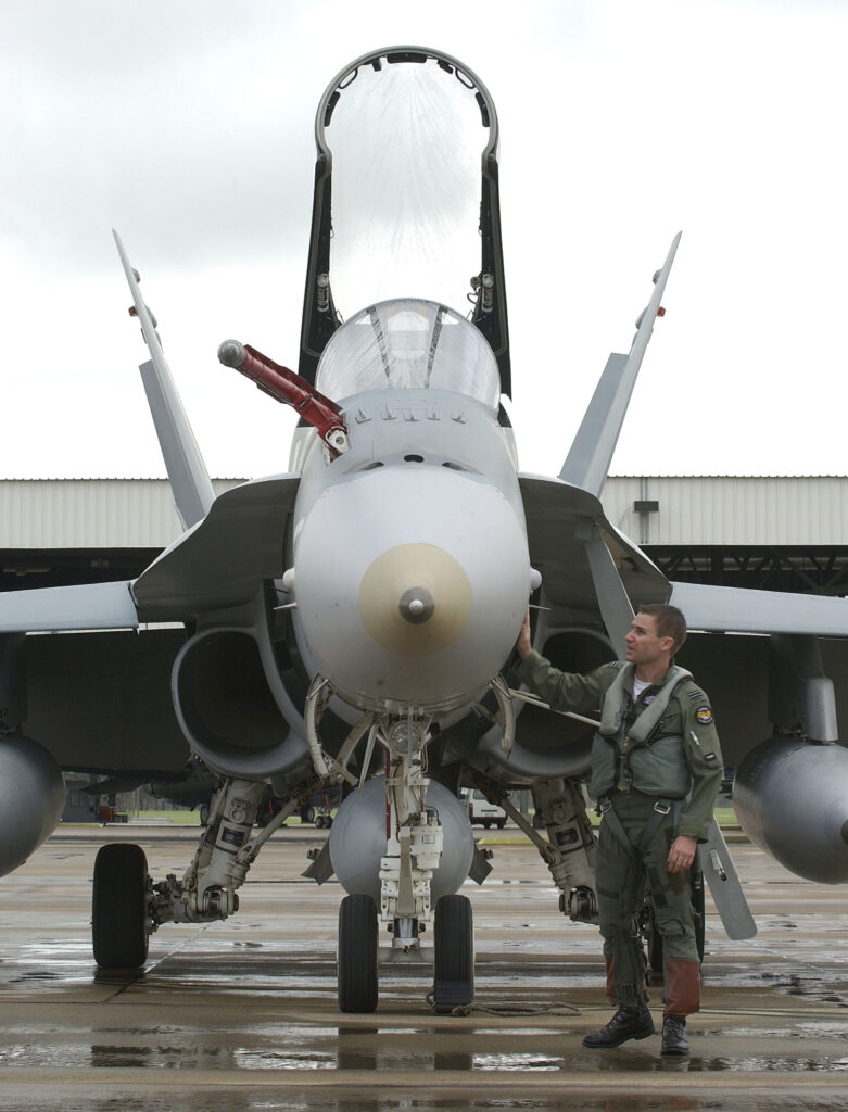 Flight Lieutenant Darren Hughes, a pilot with 75 Squadron RAAF, performs a pre-flight walkaround of his F/A-18 before a mission during the East Coast Air Defence Exercise (ECADEX 05).