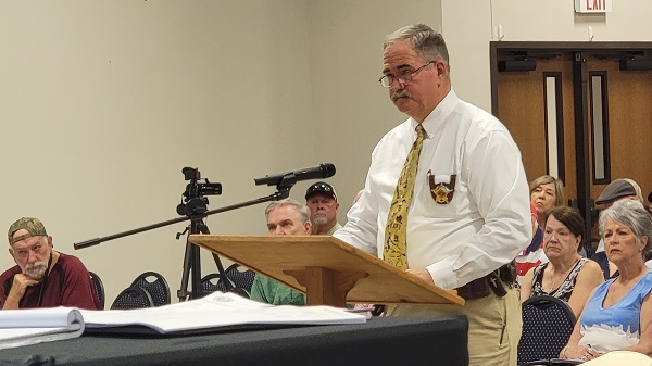 San Jacinto County Sheriff Greg Capers presents a proposed disaster declaration to commissioners' court. (Bob Price/Breitbart Texas)