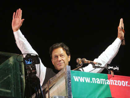 Former Pakistani Prime Minister Imran Khan waves to his supporters during an anti-governme