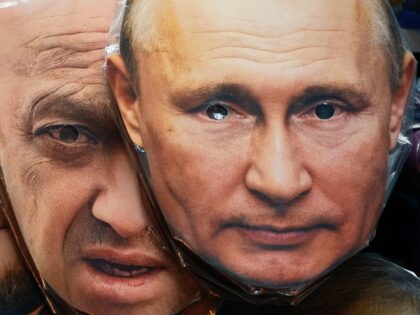 FILE - Face masks depicting Russian President Vladimir Putin, right, and owner of private military company Wagner Group Yevgeny Prigozhin are displayed among others for sale at a souvenir shop in St. Petersburg, Russia, Sunday, June 4, 2023. Prigozhin, the owner of the Wagner private military contractor who called for …
