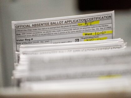 Absentee ballots are seen during a count at the Wisconsin Center for the midterm election Tuesday, Nov. 8, 2022, in Milwaukee. (AP Photo/Morry Gash)