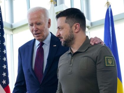TOPSHOT - US President Joe Biden (L) walks with Ukraine's President Volodymyr Zelensky ahead of a working session on Ukraine during the G7 Leaders' Summit in Hiroshima on May 21, 2023. (Photo by Susan Walsh / POOL / AFP) (Photo by SUSAN WALSH/POOL/AFP via Getty Images)