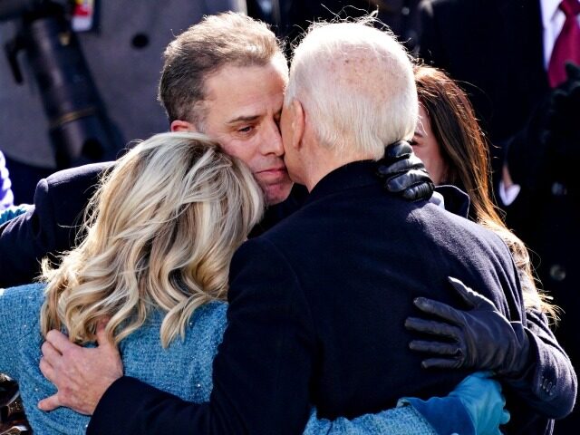 WASHINGTON, DC - JANUARY 20: U.S. President Joe Biden, right, is comforted by his son Hunter Biden and First Lady Jill Biden after being sworn in during the inauguration ceremony on the West Front of the U.S. Capitol on January 20, 2021 in Washington, DC. During today's inauguration ceremony Joe …