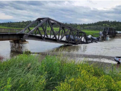 Several train cars are immersed in the Yellowstone River after a bridge collapse near Colu