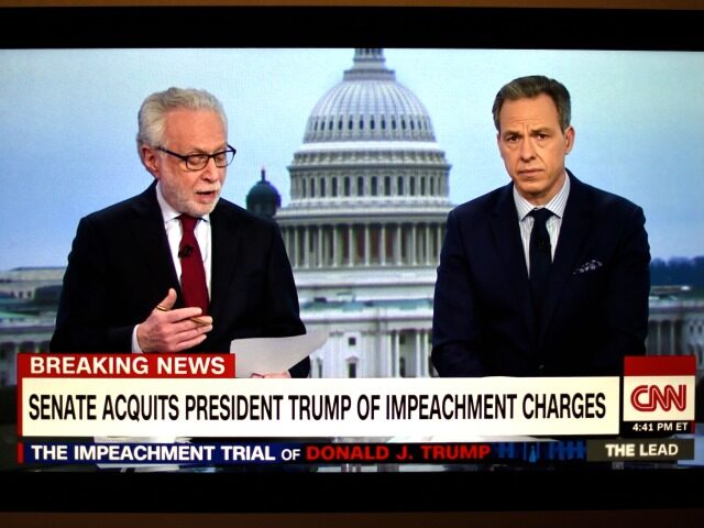 FEBRUARY 5, 2020: A television screen shot during live CNN coverage of the President Donald Trump impeachment trial on February 5, 2020, shows CNN news anchors Wolf Blitzer and Jake Tapper moments after the final vote in the U.S. Senate which acquitted Trump of two articles of impeachment. (Photo by …