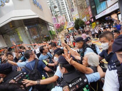 HONG KONG, CHINA - 2023/06/04: An old woman is arrested by police at Causeway Bay during t