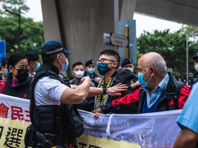 Members of the League of Social Democrats (LSD) hold a banner outside the West Kowloon Magistrates' Courts during a hearing for 47 pro-democracy activists in Hong Kong, China, on Monday, Feb. 6, 2023. The mass trial of prominent pro-democracy figures in Hong Kong got underway Monday in the city's largest …