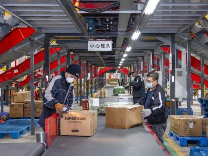 YUNCHENG, CHINA - JANUARY 13: Employees sort parcels at a logistics base of SF Express ahead of the Chinese New Year, the Year of the Rabbit, on January 13, 2023 in Yuncheng, Shanxi Province of China. (Xue Jun/VCG via Getty Images)