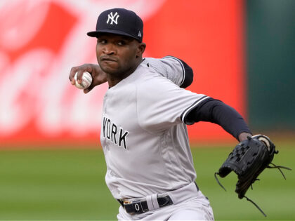 OAKLAND, CALIFORNIA - JUNE 28: Domingo German #0 of the New York Yankees pitches against t