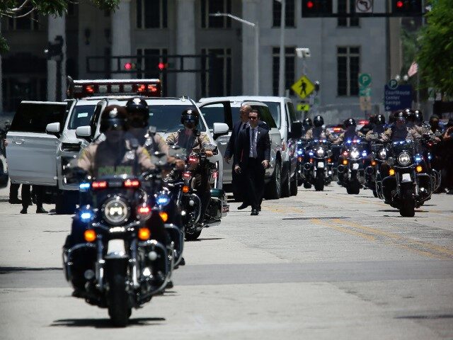 Police motorcycles used to escort the motorcade carrying former President Donald Trump arr