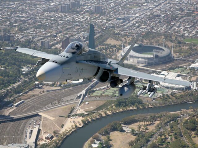 F/A-18 Hornet from 77Squadron Royal Australian Air Force flies over Docklands on its way t