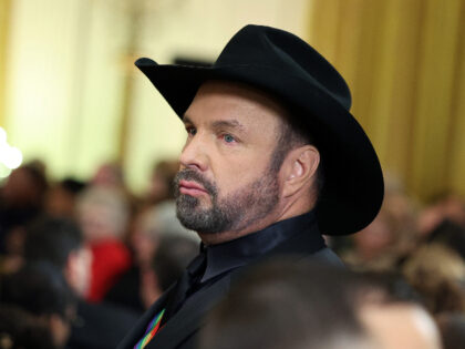 WASHINGTON, DC - DECEMBER 04: Singer Garth Brooks attends a reception for the 2022 Kennedy Center honorees hosted by U.S. President Joe Biden, at the White House on December 04, 2022 in Washington, DC. This year's honorees include actor and filmmaker George Clooney; singer-songwriter Amy Grant; singer Gladys Knight; composer …
