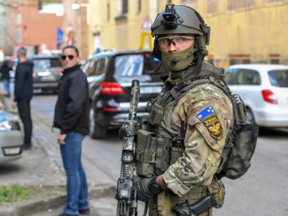 Members of the Counter Terrorism Centre (TEK) stand guard outside the Metropolitan Court before the arrival of a Syrian man, who was arrested for alleged terrorist activities in Syria, on March 24, 2019 in Budapest. - Hungarian police on arrested on March 22, 2019 a Syrian man suspected of being …