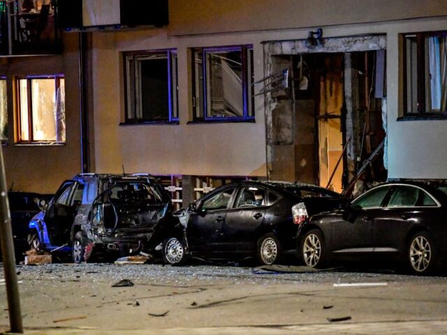 An explosion damaged residential building and cars are seen in central Stockholm on Januar