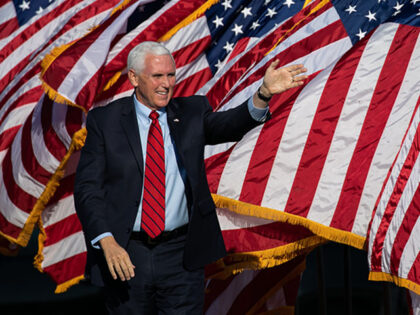 Vice President Mike Pence waves to the crowd as he arrives to a rally in support of Sen. D