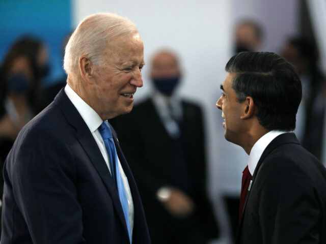 U.S. President Joe Biden, left, speaks with Rishi Sunak, U.K. Chancellor of the Exchequer,