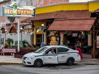 A taxi waits outside a restaurant in the Hotel Zone of Cancun, Quintana Roo state, Mexico,
