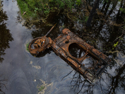 KOLYCHIVKA, UKRAINE - MAY 31: A burnt tank is seen in the overflowed Uhor river on May 31, 2022 in Kolychivka, Ukraine. Chernihiv, northeast of Kyiv, was an early target of Russia's offensive after its Feb. 24 invasion. While they failed to capture the city, Russian forces battered large parts …