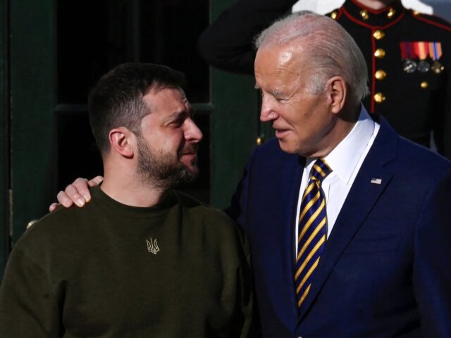 TOPSHOT - US President Joe Biden welcomes Ukraine's President Volodymyr Zelensky on the So