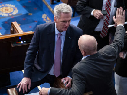 Representative Kevin McCarthy, a Republican from California, speaks with Representative Chip Roy, a Republican from Texas, right, during a meeting of the 118th Congress in the House Chamber at the US Capitol in Washington, DC, US, on Friday, Jan. 6, 2023. The emerging deal McCarthy is discussing to make him …