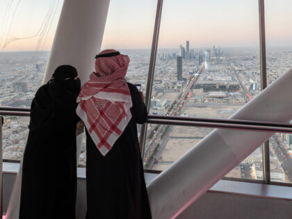 Visitors looks out towards the city skyline from the skybridge of the Kingdom Center, in R
