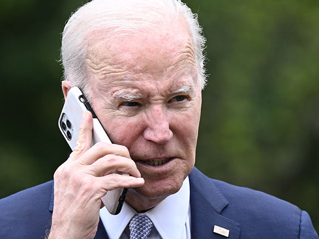 President Joe Biden speaks on the phone during a National Small Business Week event in the Rose Garden of the White House in Washington, DC, on May 1, 2023. (Photo by Brendan SMIALOWSKI / AFP) (Photo by BRENDAN SMIALOWSKI/AFP via Getty Images)