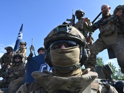 Fighters of the Russian Volunteer Corps attend a presentation for the media in northern Ukraine, not far from the Russian border, on May 24, 2023, amid Russian military invasion on Ukraine. Russian nationals fighting on Ukraine's side on May 24 hailed as a "success" a brazen mission to send groups …
