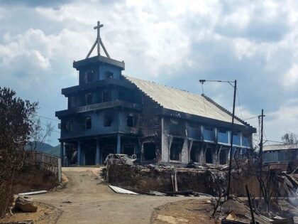 The remains of a burnt church are seen in Langching village some 45 km from Imphal on May