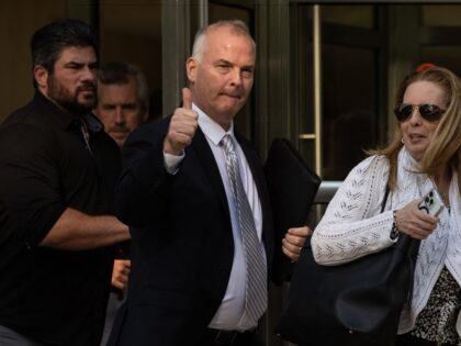 Retired NYPD sergeant Michael McMahon (C) leaves Brooklyn Federal Court in New York City on May 31, 2023. America's first federal trial over China's alleged attempts to forcibly repatriate its citizens under a campaign known as "Operation Fox Hunt" got underway in New York on Wednesday. Three defendants went on …