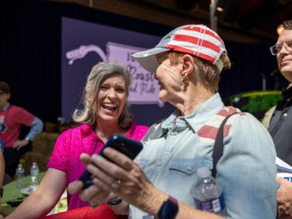 Senator Joni Ernst, a Republican from Iowa, left, greets attendees during her annual Roast and Ride in Des Moines, Iowa, US, on Saturday, June 3, 2023. The annual fundraiser is featuring several 2024 presidential hopefuls with this year's proceeds to be donated to the veteran's charity Freedom Foundation of Cedar …