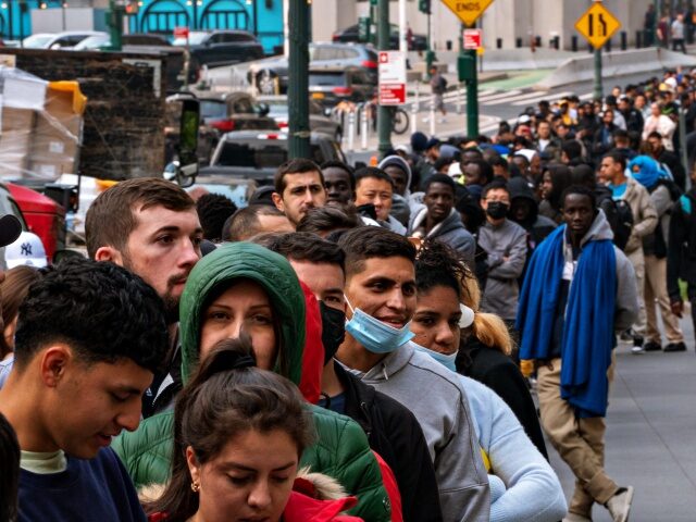 NEW YORK, NEW YORK - JUNE 6:Hundreds of asylum seekers line up outside of the Jacob K. Jav