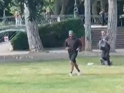 A screen grab taken from a video obtained by AFPTV on June 8, 2023 shows a man armed with a knife running away after he attacked a group of pre-school children playing by a lake in the French Alps city of Annecy, wounding four as well as an adult and …