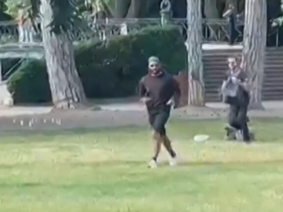 A screen grab taken from a video obtained by AFPTV on June 8, 2023 shows a man armed with a knife running away after he attacked a group of pre-school children playing by a lake in the French Alps city of Annecy, wounding four as well as an adult and …