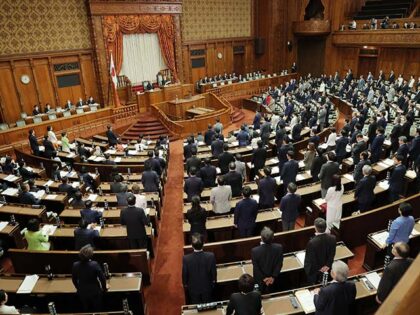 Members of the chamber vote to pass the revised Immigration Control and Refugee Recognition Act, which reviews the detention and deportation rules of foreigners, during a plenary session of the House of Councillors at the parliament building in Tokyo on June 9, 2023. Japan enacted an immigration law on June …