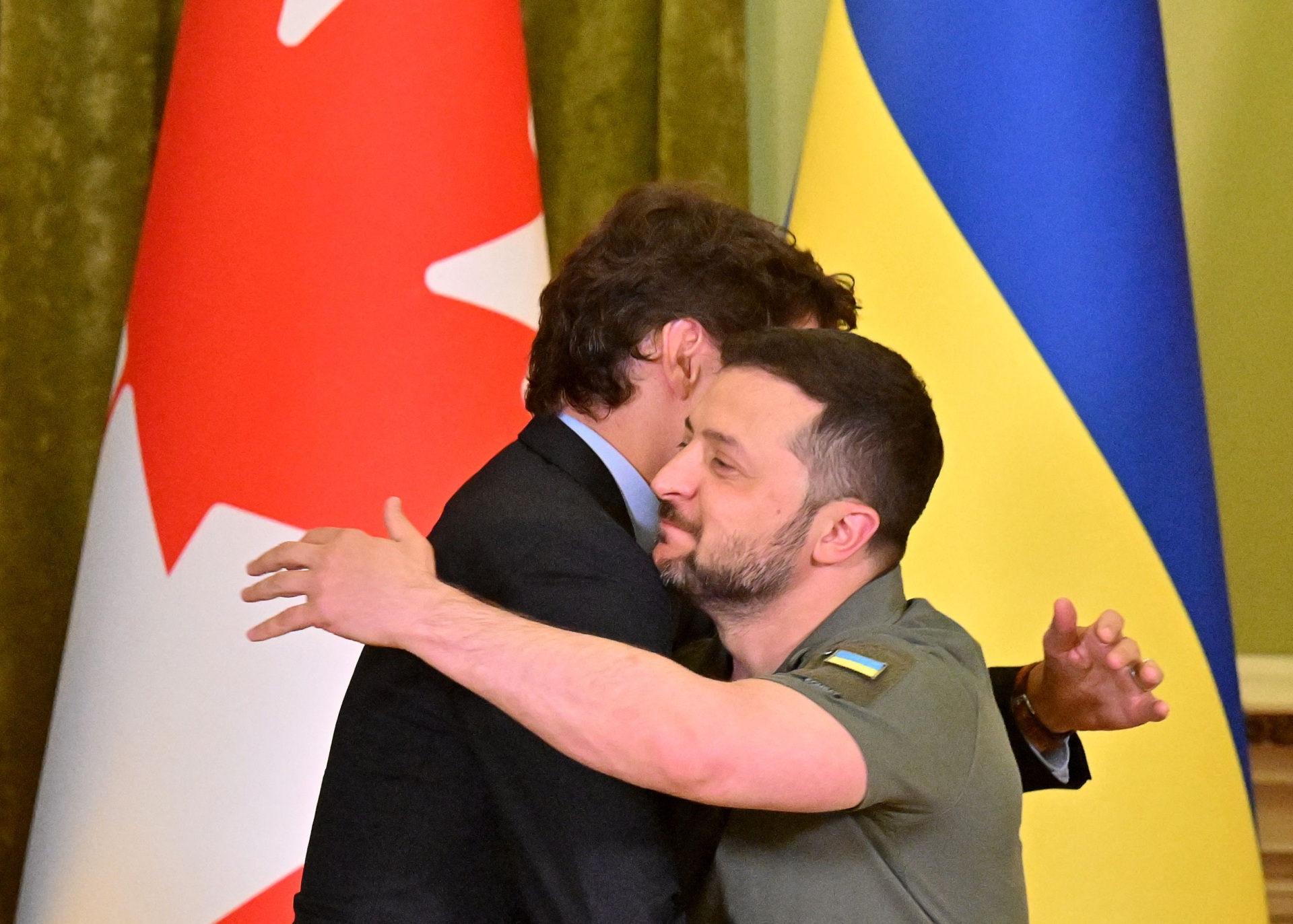Ukrainian President Volodymyr Zelensky (R) and Canadian Prime Minister Justin Trudeau hug during a press conference following their talks in Kyiv on June 10, 2023. (Photo by Sergei SUPINSKY / AFP) (Photo by SERGEI SUPINSKY/AFP via Getty Images)