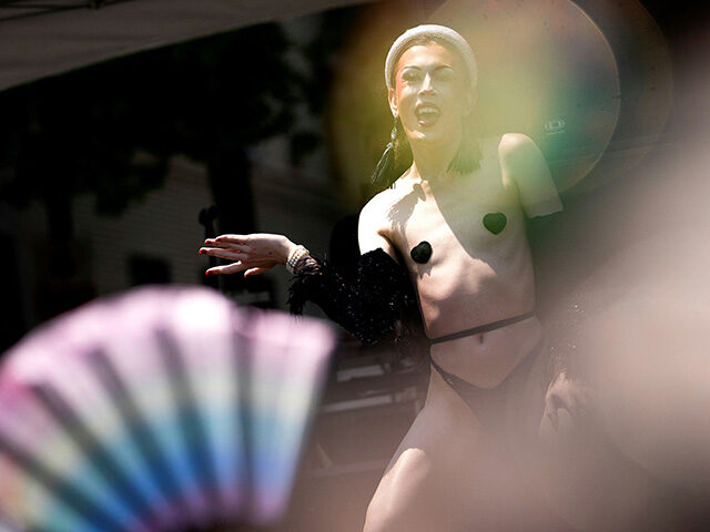 A drag performer dances on stage during the Capital Pride Festival in Washington, DC, on J