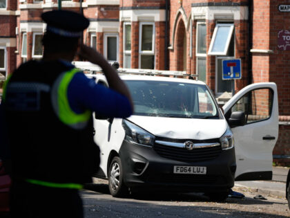 NOTTINGHAM, ENGLAND - JUNE 13: A police officer guards an area of Bentinck road near a van