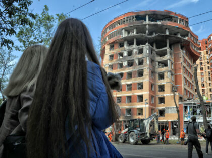 ODESA, UKRAINE - JUNE 14, 2023 - Two women watch the response effort to a recent missile a