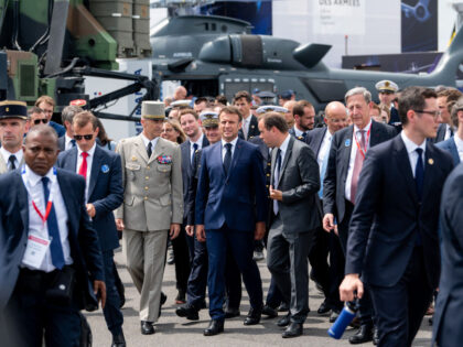Emmanuel Macron, France's president, tours the Paris Air Show in Le Bourget, Paris, France, on Monday, June 19, 2023. At the Paris Air Show, airlines and leasing companies will place orders, manufacturers will show off civil and military aircraft, and executives will tout new technologies like flying taxis and electric …