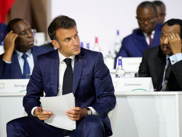 French President Emmanuel Macron listens during the closing session of the New Global Fina